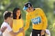 PARIS, FRANCE - JULY 22: Bradley Wiggins of Great Britain and SKY Procyling inadvertadly shakes hands with a podium invader after the twentieth and final stage of the 2012 Tour de France, from Rambouillet to the Champs-Elysees on July 22, 2012 in Paris, France. (Photo by Bryn Lennon/Getty Images)