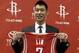 HOUSTON, TX - JULY 19: Jeremy Lin of the Houston Rockets displays his jersey during a press conference at Toyota Center on July 19, 2012 in Houston, Texas. (Photo by Bob Levey/Getty Images)