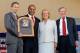 COOPERSTOWN, NY - JULY 22: Barry Larkin (2nd L) poses for a photograph with (L-R) Baseball Hall of Fame president Jeff Idelson, Hall of Fame chairman Jane Forbes Clark and MLB commissioner Bud Selig at Clark Sports Center during the Baseball Hall of Fame induction ceremony on July 22, 2012 in Cooperstown, New York. Larkin played his entire 19 year major league career with the Cincinnati Reds, compiling a .295 average, 2,340 hits, 1,329 runs, 198 home runs, 960 runs batted in and stole 379 bases. He was named to 12 All-Star games and was the 1995 National League MVP. Larkin was also a member of the 1990 World Series championship team. (Photo by Jim McIsaac/Getty Images)