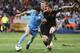 PORT ELIZABETH, SOUTH AFRICA - JULY 10: Arne Friedrich of Germany battles for the ball with Luis Suarez of Uruguay during the 2010 FIFA World Cup South Africa Third Place Play-off match between Uruguay and Germany at The Nelson Mandela Bay Stadium on July 10, 2010 in Port Elizabeth, South Africa. (Photo by Joern Pollex/Getty Images)