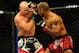Jul 21, 2012; Calgary, AB, CANADA; Tim Boetsch (blue gloves) and Hector Lombard (red gloves) during the middleweight bout of UFC 149 at the Scotiabank Saddledome. Mandatory Credit: Anne-Marie Sorvin-US PRESSWIRE