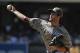 SAN DIEGO, CA - JULY 22: Huston Street #16 of the San Diego Padres pitches during the ninth inning of a baseball game against the Colorado Rockies at Petco Park on July 22, 2012 in San Diego, California. The Padres won 3-2. (Photo by Denis Poroy/Getty Images)
