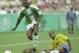 31 Jul 1996: Flavio of Brazil slides in to tackle Daniel Amokachi of Nigeria during their match in Athens Georgia at the 1996 Centennial Olympic Games. Nigeria won the match 4-3 in extra time.