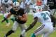 Dec 4, 2011; Miami, FL, USA; Oakland Raiders tight end Brandon Myers (83) tries to get past Miami Dolphins cornerback Vontae Davis (21) at Sun Life Stadium. The Dolphins defeated the Raiders 34-14. Mandatory Credit: Kirby Lee/Image of Sport-US PRESSWIRE