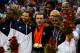 Mike Krzyzewski (center) coached the 2008 USA Olympic Basketball team to a Gold Medal