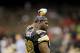November 06, 2011; New Orleans, LA, USA; New Orleans Saints defensive tackle Sedrick Ellis (98) pours water over his head during warmups prior to kickoff against the Tampa Bay Buccaneers at the Mercedes-Benz Superdome. Mandatory Credit: Crystal LoGiudice-US PRESSWIRE
