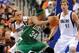 Feb 20, 2012; Dallas, TX, USA; Boston Celtics small forward Paul Pierce (34) drives the ball past Dallas Mavericks small forward Shawn Marion (0) and power forward Dirk Nowitzki (41) during the second quarter at the American Airlines Center. Mandatory Credit: Jerome Miron-US PRESSWIRE