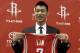 HOUSTON, TX - JULY 19: Jeremy Lin of the Houston Rockets displays his jersey during a press conference at Toyota Center on July 19, 2012 in Houston, Texas. (Photo by Bob Levey/Getty Images)