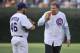 CHICAGO, IL - JULY 18: Will Ferrell (R) and Ryan Dempster #46 of the Chicago Cubs eat pizza on the pitcher's mound before Ferrell threw out a ceremonial first pitch before the game against the Miami Marlins at Wrigley Field on July 18, 2012 in Chicago, Illinois. (Photo by Brian Kersey/Getty Images)