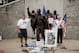 STATE COLLEGE, PA - JULY 21: A family poses for a photo with the statue of former Penn State University football coach Joe Paterno stands outside Beaver Stadium July 21, 2012 in State College, Pennsylvania. Penn State's president Rodney Erickson is expected to make a decision on whether or not to remove the statue in the wake of the child sex scandal of former assistant football coach Jerry Sandusky. It's believed that Paterno had detailed knowledge of Jerry Sandusky sexually abusing children before and after Sandusky retired from coaching at Penn State. (Photo by Jeff Swensen/Getty Images)