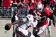 November 5, 2011; Columbus, OH, USA; Indiana Hoosiers quarterback Tre Roberson (5) tries to evade Ohio State Buckeyes defensive lineman Michael Bennett (63) at Ohio Stadium. Ohio State won the game 34-20. Mandatory Credit: Greg Bartram-US PRESSWIRE