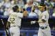 TORONTO, CANADA - JULY 26: Josh Reddick #16 of the Oakland Athletics celebrates his first inning home run with teammate Yoenis Cespedes #52 during MLB game action gainst the Toronto Blue Jays July 26, 2012 at Rogers Centre in Toronto, Ontario, Canada. (Photo by Brad White/Getty Images)