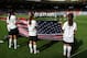 GLASGOW, SCOTLAND - JULY 25: USA sings their national anthem during the Women's Football first round Group G Match of the London 2012 Olympic Games between United States and France, at Hampden Park on July 25, 2012 in Glasgow, Scotland. (Photo by Stanley Chou/Getty Images)