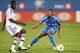 MONTREAL, CANADA - JULY 24: Aly Cissokho #20 of Olympique Lyonnais passes the ball in front of Evan James #36 of the Montreal Impact during the match at the Saputo Stadium on July 24, 2012 in Montreal, Quebec, Canada. The Olympique defeated the Impact 4-2 in a shootout. (Photo by Richard Wolowicz/Getty Images)