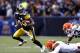 CLEVELAND, OH - JANUARY 01: Wide receiver Antonio Brown #84 of the Pittsburgh Steelers runs by defenders Chris Gocong #51 and Joe Haden #23 of the Cleveland Browns at Cleveland Browns Stadium on January 1, 2012 in Cleveland, Ohio. (Photo by Matt Sullivan/Getty Images)