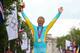 Alexandre Vinokourov of Kazakhstan celebrates winning gold in the Men's road race.
