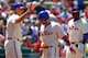 PHILADELPHIA, PA - JULY 25: Shane Victorino #8 of the Philadelphia Phillies is congratulated by Hunter Pence #3 after scoring on a double by Chase Utley #26 (not pictured) against of the Milwaukee Brewers during a MLB baseball game on July 25, 2012 at Citizens Bank Park in Philadelphia, Pennsylvania. (Photo by Rich Schultz/Getty Images)