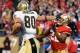 SAN FRANCISCO, CA - JANUARY 14: Jimmy Graham #80 of New Orleans Saints pushes away from Carlos Rogers #22 of the San Francisco 49ers and goes 66 yards for a touchdown in the fourth quarter during the NFC Divisional playoff game at Candlestick Park on January 14, 2012 in San Francisco, California. (Photo by Thearon W. Henderson/Getty Images)