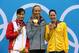 LONDON, ENGLAND - JULY 29: Silver medallist Ying Lu of China, gold medallist Dana Vollmer of the United States and bronze medallist Alicia Coutts of Australia pose on the podium during the medal ceremony on Day 2 of the London 2012 Olympic Games at the Aquatics Centre on July 29, 2012 in London, England. (Photo by Clive Rose/Getty Images)