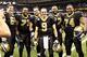 NEW ORLEANS, LA - DECEMBER 26: Quarterback Drew Brees #9 and the offensive line of the New Orleans Saints pose after the game for a photo after Brees threw a nine-yard touchdown pass to running back Darren Sproles #43 and broke the single-season passing record in the fourth quarter against the Atlanta Falcons at Mercedes-Benz Superdome on December 26, 2011 in New Orleans, Louisiana. The Saints defeated the Falcons 45-16. (Photo by Wesley Hitt/Getty Images)