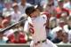 BOSTON, MA - JUNE 24: Dustin Pedroia #15 of the Boston Red Sox follows through on a hit during the fifth inning of the interleague game against the Atlanta Braves at Fenway Park on June 24, 2012 in Boston, Massachusetts. (Photo by Winslow Townson/Getty Images)