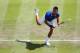 LONDON, ENGLAND - JULY 29: Novak Djokovic of Serbia serves during the Men's Singles Tennis match against Fabio Fognini of Italy on Day 2 of the London 2012 Olympic Games at the All England Lawn Tennis and Croquet Club in Wimbledon on July 29, 2012 in London, England. (Photo by Clive Brunskill/Getty Images)