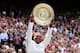 LONDON, ENGLAND - JULY 07: Serena Williams of the USA lifts the winners trophy and celebrates after her Ladies’ Singles final match against Agnieszka Radwanska of Poland on day twelve of the Wimbledon Lawn Tennis Championships at the All England Lawn Tennis and Croquet Club on July 7, 2012 in London, England. (Photo by Julian Finney/Getty Images)