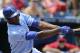 KANSAS CITY, MO - JULY 22: Lorenzo Cain #6 of the Kansas City Royals hits a sacrifice fly during a game against the Minnesota Twins in the fourth inning at Kauffman Stadium on July 22, 2012 in Kansas City, Missouri. (Photo by Ed Zurga/Getty Images)