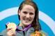 LONDON, ENGLAND - JULY 30: Missy Franklin of the United States celebrates with her gold medal during the medal ceremony for the Women's 100m Backstroke on Day 3 of the London 2012 Olympic Games at the Aquatics Centre on July 30, 2012 in London, England. (Photo by Adam Pretty/Getty Images)