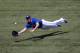 TORONTO, CANADA - JULY 28: Travis Snider #45 of the Toronto Blue Jays makes a diving catch in the 1st inning during MLB game action against the Detroit Tigers on July 28, 2012 at Rogers Centre in Toronto, Ontario, Canada. (Photo by Tom Szczerbowski/Getty Images)