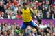 MANCHESTER, UNITED KINGDOM - JULY 29: Hulk of Brazil leaps over Alexandr Gutor of Belarus during the Men's Football first round Group C Match between Brazil and Belarus on Day 2 of the London 2012 Olympic Games at Old Trafford on July 29, 2012 in Manchester, England. (Photo by Francis Bompard/Getty Images)