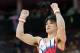 LONDON, ENGLAND - JULY 30: Kohei Uchimura of Japan reacts after competing in the horizontal bar in the Artistic Gymnastics Men's Team final on Day 3 of the London 2012 Olympic Games at North Greenwich Arena on July 30, 2012 in London, England. (Photo by Ronald Martinez/Getty Images)