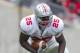 April 21, 2012; Columbus, OH, USA; Ohio State Buckeyes running back Bri'Onte Dunn evades a tackle attempted by linebacker Ryan Shazier (10) during the spring game at Ohio Stadium. Mandatory Credit: Greg Bartram-US PRESSWIRE