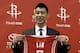 HOUSTON, TX - JULY 19: Jeremy Lin of the Houston Rockets displays his jersey during a press conference at Toyota Center on July 19, 2012 in Houston, Texas. (Photo by Bob Levey/Getty Images)