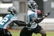 June 12, 2012; Jacksonville FL, USA; Jacksonville Jaguars wide receiver Justin Blackmon (14) is pursued by cornerback Kevin Rutland (22) after a reception during minicamp at Florida Blue Health & Wellness Practice Fields. Mandatory Credit: Phil Sears-US PRESSWIRE