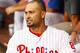 PHILADELPHIA, PA - JULY 23: Shane Victorino #8 of the Philadelphia Phillies reacts after he was hit by a pitch on the forearm on a swinging third strike as called by home plate umpire Tom Hallion #20 in the first inning against the Milwaukee Brewers during a MLB baseball game on July 23, 2012 at Citizens Bank Park in Philadelphia, Pennsylvania. (Photo by Rich Schultz/Getty Images)