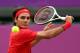 LONDON, ENGLAND - JULY 28: Roger Federer of Switzerland returns a shot against Alejandro Falla of Colombia during their Men's Singles Tennis match on Day 1 of the London 2012 Olympic Games at the All England Lawn Tennis and Croquet Club in Wimbledon on July 28, 2012 in London, England. (Photo by Clive Brunskill/Getty Images)