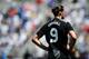 BALTIMORE, MD - JULY 28: Andrew Carroll #9 of Liverpool waits for play to resume against the Tottenham Hotspur during a pre-season tour friendly match at M&T Bank Stadium on July 28, 2012 in Baltimore, Maryland. The match ended in a, 0-0, draw. (Photo by Patrick Smith/Getty Images)