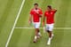 LONDON, ENGLAND - JULY 30: Roger Federer and Stanislas Wawrinka of Switzerland talk tactics during their Men's Doubles Tennis match against Go Soeda of Japan and Kei Nishikori of Japan on Day 3 of the London 2012 Olympic Games at the All England Lawn Tennis and Croquet Club in Wimbledon on July 30, 2012 in London, England. (Photo by Clive Brunskill/Getty Images)