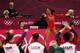 LONDON, ENGLAND - JULY 31: Gabrielle Douglas of the United States performs on the floor exercise as her team cheers her on in the Artistic Gymnastics Women's Team final on Day 4 of the London 2012 Olympic Games at North Greenwich Arena on July 31, 2012 in London, England. (Photo by Jamie Squire/Getty Images)