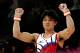 LONDON, ENGLAND - AUGUST 01: Kohei Uchimura of Japan celebrates after dismounting the horizontal bar in the Artistic Gymnastics Men's Individual All-Around final on Day 5 of the London 2012 Olympic Games at North Greenwich Arena on August 1, 2012 in London, England. (Photo by Ronald Martinez/Getty Images)
