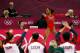 LONDON, ENGLAND - JULY 31: Gabrielle Douglas of the United States performs on the floor exercise as her team cheers her on in the Artistic Gymnastics Women's Team final on Day 4 of the London 2012 Olympic Games at North Greenwich Arena on July 31, 2012 in London, England. (Photo by Jamie Squire/Getty Images)