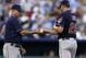 KANSAS CITY, MO - JULY 31: Derek Lowe #26 of the Cleveland Indians hands the ball over to manager Manny Acta #11 as he leaves a game against the Kansas City Royals in the third inning at Kauffman Stadium on July 31, 2012 in Kansas City, Missouri. (Photo by Ed Zurga/Getty Images)
