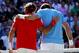 LONDON, ENGLAND - AUGUST 03: (L-R) Roger Federer of Switzerland is congratulated by Juan Martin Del Potro of Argentina after his 4-6, 7-6, 19-17 win in the Semifinal of Men's Singles Tennis on Day 7 of the London 2012 Olympic Games at Wimbledon on August 3, 2012 in London, England. (Photo by Clive Brunskill/Getty Images)