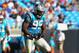 CHARLOTTE, NC - OCTOBER 23: Charles Johnson #95 of the Carolina Panthers celebrates a sack against the Washington Redskins at the Bank of America Stadium on October 23, 2011 in Charlotte, North Carolina. (Photo by Dilip Vishwanat/Getty Images)
