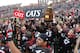 CINCINNATI, OH - DECEMBER 03: Rob Trigg #45 of the Cincinnati Bearcats holds the the Big East Championship Trophy as he celebrates with fans and teammates after the Bearcats defeated the Connecticut Huskies 35-27 to claim their share of the 2011 Big East Championship on December 3, 2011 at Nippert Stadium in Cincinnati, Ohio. (Photo by Tyler Barrick/Getty Images)