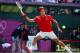 LONDON, ENGLAND - AUGUST 03: Roger Federer of Switzerland returns a shot against Juan Martin Del Potro of Argentina in the Semifinal of Men's Singles Tennis on Day 7 of the London 2012 Olympic Games at Wimbledon on August 3, 2012 in London, England. (Photo by Clive Brunskill/Getty Images)