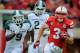 LINCOLN, NE - OCTOBER 29: Quarterback Taylor Martinez #3 of the Nebraska Cornhuskers runs for a first down against the Michigan State Spartans defense during their game at Memorial Stadium October 29, 2011 in Lincoln, Nebraska. Nebraska defeated Michigan State 24-3. (Photo by Eric Francis/Getty Images)