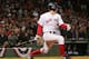BOSTON - OCTOBER 17: Bill Mueller #11 of the Boston Red Sox hits the game-tying RBI single in the ninth inning against the New York Yankees during game four of the American League Championship Series on October 17, 2004 at Fenway Park in Boston, Massachusetts. (Photo by Ezra Shaw/Getty Images)