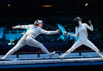 U.S. fencer Courtney Hurley, left, attempts to score a touch against Anna Sivkova of Russia in a bronze medal match.